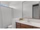 Modern bathroom featuring wood vanity, quartz counters, and bright white paint at 16430 W Alameda Rd, Surprise, AZ 85387