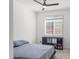 Bedroom with plush carpet, window, and ceiling fan at 16430 W Alameda Rd, Surprise, AZ 85387
