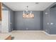 Modern dining area with stylish lighting and neutral walls, perfect for entertaining at 16430 W Alameda Rd, Surprise, AZ 85387