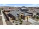 Inviting single-story home with stone accents, desert landscaping, and a two-car garage at 16430 W Alameda Rd, Surprise, AZ 85387