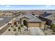 Charming single-story home with a well-manicured front yard and neutral color palette at 16430 W Alameda Rd, Surprise, AZ 85387