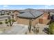 Exterior elevation of a single Gathering home with a desert rock garden and two car garage at 16430 W Alameda Rd, Surprise, AZ 85387