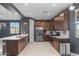 Well-lit kitchen with stainless steel appliances, ample cabinet space, and stylish backsplash at 16430 W Alameda Rd, Surprise, AZ 85387