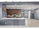 Bright open-concept kitchen and dining area with modern lighting and neutral color scheme at 16430 W Alameda Rd, Surprise, AZ 85387