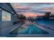 Inviting backyard features a refreshing swimming pool and mural-covered walls for enhanced privacy at 1700 W Paisley Dr, San Tan Valley, AZ 85144