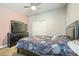 Bedroom with a bed, ceiling fan, and closet with sliding doors at 1700 W Paisley Dr, San Tan Valley, AZ 85144