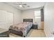 Bedroom with a bed, ceiling fan, and closet with sliding doors at 1700 W Paisley Dr, San Tan Valley, AZ 85144
