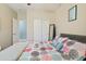 This bedroom has a patterned comforter set, a mirror, and a door to a closet at 1700 W Paisley Dr, San Tan Valley, AZ 85144