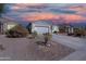 A single-Gathering home featuring low-maintenance landscaping, a two-car garage, and a concrete driveway at 1700 W Paisley Dr, San Tan Valley, AZ 85144