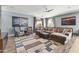 A spacious living room with a large rug, neutral paint, and comfortable seating at 1700 W Paisley Dr, San Tan Valley, AZ 85144