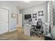 Office features a desk, computer, rolling chair, printer and decorative shelves at 1700 W Paisley Dr, San Tan Valley, AZ 85144