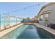 Refreshing pool with muraled perimeter fencing in a sunny backyard at 1700 W Paisley Dr, San Tan Valley, AZ 85144