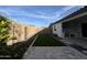 An outdoor kitchen and artificial turf highlight the property's backyard at 17168 W Middlebury St, Surprise, AZ 85388