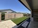 An inviting backyard featuring artificial turf, gravel accents, and a built-in outdoor barbecue at 17168 W Middlebury St, Surprise, AZ 85388