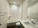 Bright bathroom features a tub-shower combo, sleek toilet, and modern vanity at 17168 W Middlebury St, Surprise, AZ 85388