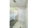 Primary bathroom featuring a glass enclosed walk-in shower and white marble tile surround at 17168 W Middlebury St, Surprise, AZ 85388