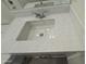 Bathroom with a white marble countertop and undermount sink with chrome hardware at 17168 W Middlebury St, Surprise, AZ 85388