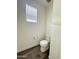 Powder room featuring sleek toilet design and bright natural light at 17168 W Middlebury St, Surprise, AZ 85388
