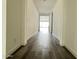Hallway features tile flooring, white walls, and doorway into a living space at 17168 W Middlebury St, Surprise, AZ 85388