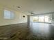 Open living area with tile floors, large windows, and recessed lighting at 17168 W Middlebury St, Surprise, AZ 85388