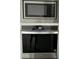 Whirlpool stainless steel built-in microwave and oven with sleek black glass fronts, adding sophistication at 17168 W Middlebury St, Surprise, AZ 85388