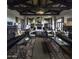 Grand clubhouse interior featuring elegant furnishings, a fireplace, and architectural details for sophisticated gatherings at 18322 W Thistle Landing Dr, Goodyear, AZ 85338