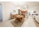 Dining Area features a chandelier hanging above a wooden table with four chairs at 18322 W Thistle Landing Dr, Goodyear, AZ 85338