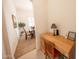 Hallway with a built-in desk and a view of the dining area at 18322 W Thistle Landing Dr, Goodyear, AZ 85338