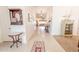 Inviting hallway with tile flooring and neutral walls, leading to the living spaces at 18322 W Thistle Landing Dr, Goodyear, AZ 85338