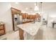 Bright kitchen features granite counters, stainless steel appliances and a large island at 18322 W Thistle Landing Dr, Goodyear, AZ 85338