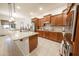 Modern kitchen featuring granite countertops, stainless steel appliances, and ample cabinet space at 18322 W Thistle Landing Dr, Goodyear, AZ 85338