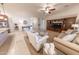 Inviting living room with neutral tones, cozy seating, and a media center at 18322 W Thistle Landing Dr, Goodyear, AZ 85338
