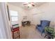 Bright home office with a desk, chair, and closet featuring ample space at 18322 W Thistle Landing Dr, Goodyear, AZ 85338