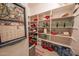 Walk-in pantry with abundant shelving for optimal storage and organization at 18322 W Thistle Landing Dr, Goodyear, AZ 85338