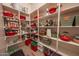 Organized walk-in pantry provides extensive shelving for all your storage needs at 18322 W Thistle Landing Dr, Goodyear, AZ 85338