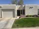 Inviting front exterior with a well-manicured lawn and attached garage at 18745 N 92Nd Dr, Peoria, AZ 85382