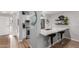 Modern kitchen with stainless steel appliances, granite countertops, and breakfast bar seating at 18745 N 92Nd Dr, Peoria, AZ 85382