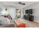 Well-decorated living room with modern media cabinet, cozy seating, and stylish decor at 18745 N 92Nd Dr, Peoria, AZ 85382