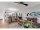 Open-concept living area with a dining table, comfortable seating, and modern décor at 18745 N 92Nd Dr, Peoria, AZ 85382