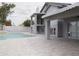 Beautiful backyard with a large patio and a sparkling private pool with lush landscaping at 18860 N 73Rd Dr, Glendale, AZ 85308