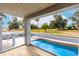 Balcony view overlooking a sparkling pool and lush golf course, enhancing the appeal of this beautiful property at 18860 N 73Rd Dr, Glendale, AZ 85308