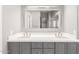 Bathroom vanity with double sinks, and large framed mirror at 18860 N 73Rd Dr, Glendale, AZ 85308