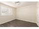 Modern bedroom with hardwood floors, neutral walls, recessed lights, and a large window with plantation shutters at 18860 N 73Rd Dr, Glendale, AZ 85308