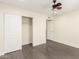 Bedroom featuring hardwood floors, neutral walls, a ceiling fan, closet with sliding doors, and recessed lights at 18860 N 73Rd Dr, Glendale, AZ 85308