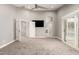 Bedroom with plush carpeting, ceiling fan, and ensuite bathroom at 18860 N 73Rd Dr, Glendale, AZ 85308