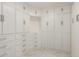 Walk-in closet with custom built-in shelving and drawers at 18860 N 73Rd Dr, Glendale, AZ 85308