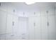Spacious walk-in closet with custom white cabinets, drawers, shelves, and rods for optimal storage at 18860 N 73Rd Dr, Glendale, AZ 85308
