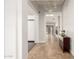 Inviting entryway with tile flooring, chandelier, textured wall, and view to the living areas at 18860 N 73Rd Dr, Glendale, AZ 85308