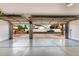 Spacious garage with open doors, offering a view of the neighborhood and ample parking at 18860 N 73Rd Dr, Glendale, AZ 85308