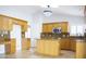 Bright, open kitchen features light wood cabinetry, granite countertops, and stainless steel appliances at 18860 N 73Rd Dr, Glendale, AZ 85308